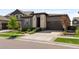 Modern home with attached garage, concrete driveway, and meticulously kept landscaping at 6530 Barnstead Dr, Castle Pines, CO 80108