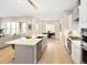 Open layout combines kitchen, dining, and living areas, enhancing everyday living and socializing at 6530 Barnstead Dr, Castle Pines, CO 80108