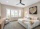 Relaxing main bedroom with lots of natural light, a ceiling fan, and a cozy sitting area at 6530 Barnstead Dr, Castle Pines, CO 80108