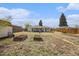 Spacious backyard featuring garden beds, a small shed, and ample open space at 3640 N Saint Paul St, Denver, CO 80205