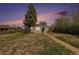 Charming single-story home with brick accents, a well-manicured lawn, and a welcoming teal front door at 3640 N Saint Paul St, Denver, CO 80205