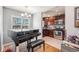 Well-lit kitchen featuring stainless steel appliances, hardwood floors, and dark wood cabinets at 3640 N Saint Paul St, Denver, CO 80205