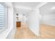 Finished basement area featuring a wet bar with floating shelves and wood-look flooring at 13058 Monaco Way, Thornton, CO 80602