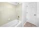 Bathroom showcasing a tiled shower and a white bathtub with a showerhead at 13058 Monaco Way, Thornton, CO 80602