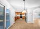 View of the kitchen with wood cabinets, stainless steel appliances, and sliding doors to the backyard at 13058 Monaco Way, Thornton, CO 80602