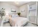 Comfortable bedroom with soft lighting, tasteful decor, and a large window with natural light at 13437 Waterthrush St, Parker, CO 80134