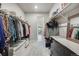 Spacious walk-in closet with ample shelving and hanging space for clothes and accessories at 13437 Waterthrush St, Parker, CO 80134