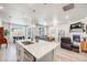 Open-concept kitchen with a large island, stainless steel appliances, and seamless flow into living spaces at 13437 Waterthrush St, Parker, CO 80134