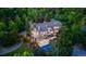 Stunning aerial view of a luxurious estate with lush landscaping, pool, and expansive outdoor deck at 5390 S Boston St, Greenwood Village, CO 80111