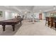 Spacious basement with a pool table, ping pong table, and bar, perfect for entertaining at 5390 S Boston St, Greenwood Village, CO 80111