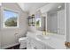 Bathroom featuring decorative shelves, a window with a view, and a tile countertop at 5390 S Boston St, Greenwood Village, CO 80111