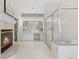 Elegant bathroom featuring marble accents, a walk-in shower, and a fireplace to enjoy as you prepare for the day at 5390 S Boston St, Greenwood Village, CO 80111