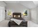 Spacious bedroom with two windows, light carpet, and a rustic bed at 5390 S Boston St, Greenwood Village, CO 80111