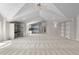 Bonus room featuring high ceilings, built-in shelves, and wet bar with countertop at 5390 S Boston St, Greenwood Village, CO 80111