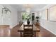 Elegant dining room with hardwood floors, large table, a chandelier, and plenty of natural light at 5390 S Boston St, Greenwood Village, CO 80111