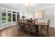 Formal dining room featuring a large window, chandelier, and spacious table for elegant dinners at 5390 S Boston St, Greenwood Village, CO 80111