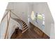 Elegant foyer with hardwood floors, a curved staircase, and a decorative chandelier creates a striking entrance at 5390 S Boston St, Greenwood Village, CO 80111