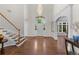 Grand foyer with soaring ceilings, hardwood floors, elegant staircase, and a stunning chandelier at 5390 S Boston St, Greenwood Village, CO 80111