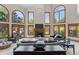 Bright and airy living room showcasing large windows, a fireplace, and contemporary furnishings at 5390 S Boston St, Greenwood Village, CO 80111