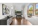 Modern living room with a unique fireplace, hardwood floors, and views of the outdoors at 5390 S Boston St, Greenwood Village, CO 80111