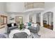 Stylish living room featuring comfortable seating, decorative rug, and views into adjacent rooms at 5390 S Boston St, Greenwood Village, CO 80111