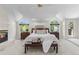 Spacious main bedroom with fireplace, large windows, and vaulted ceilings for natural light at 5390 S Boston St, Greenwood Village, CO 80111