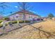Manicured backyard with lush greenery, and a well-maintained lawn and exterior view at 16773 W 61St Ln, Arvada, CO 80403