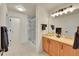 Well-lit bathroom featuring a vanity with a sink and a shower with glass doors at 16773 W 61St Ln, Arvada, CO 80403