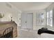 Bright bedroom features shutters, neutral decor and a desk space. It's great for relaxation and focus at 16773 W 61St Ln, Arvada, CO 80403