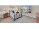 Bedroom featuring large windows and neutral walls at 16773 W 61St Ln, Arvada, CO 80403
