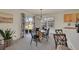 Dining area with natural light and sliding glass door access to the outdoors at 16773 W 61St Ln, Arvada, CO 80403