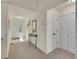 Inviting entryway with neutral tones, featuring a console table and closet for practical storage at 16773 W 61St Ln, Arvada, CO 80403