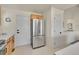 Kitchen with stainless steel refrigerator and ample storage space at 16773 W 61St Ln, Arvada, CO 80403
