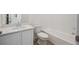 This bathroom is equipped with modern white cabinets, solid surface countertop and white tile tub/shower surround at 1366 Penner Dr, Erie, CO 80026