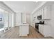 Modern kitchen featuring white cabinets, stainless steel appliances, and a center island with sink at 1366 Penner Dr, Erie, CO 80026
