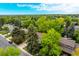 Overhead view of a home, surrounded by mature landscaping and tree-lined streets, in a quiet neighborhood at 9540 E Grand Pl, Greenwood Village, CO 80111