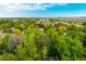 Panoramic aerial image capturing a house surrounded by a community of verdant trees and greenery at 9540 E Grand Pl, Greenwood Village, CO 80111