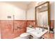 Charming bathroom with vintage tile work, cabinet space, and a unique sink and mirror at 9540 E Grand Pl, Greenwood Village, CO 80111