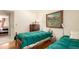 Cozy bedroom featuring two twin beds, a chest of drawers, and charming decor at 9540 E Grand Pl, Greenwood Village, CO 80111