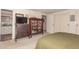 Bedroom showcasing carpet, large dresser, and closet with sliding doors at 9540 E Grand Pl, Greenwood Village, CO 80111