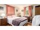 Bedroom with hardwood floor, bed, natural light, and dresser at 9540 E Grand Pl, Greenwood Village, CO 80111