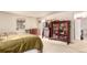 Bedroom with carpet, window, and display cabinet with glass doors at 9540 E Grand Pl, Greenwood Village, CO 80111