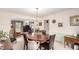 Dining room area featuring modern lighting, hardwood floors, and neutral wall colors at 9540 E Grand Pl, Greenwood Village, CO 80111