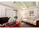 Cozy living room with beamed ceiling, a comfortable couch, and bright decor at 9540 E Grand Pl, Greenwood Village, CO 80111