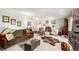 Bright living room featuring comfortable seating, hardwood floors, and ample natural light at 9540 E Grand Pl, Greenwood Village, CO 80111