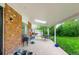 Covered patio with brick detailing and outdoor seating, perfect for entertaining at 9540 E Grand Pl, Greenwood Village, CO 80111