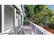 View of the back deck featuring wood planks, white railing, and seating for enjoying the outdoors at 15926 Butterwort Cir, Parker, CO 80134