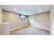 Finished basement featuring carpet flooring and a window bringing in natural light at 15926 Butterwort Cir, Parker, CO 80134