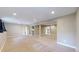 Expansive carpeted basement with multiple entryways, offering flexibility for various uses at 15926 Butterwort Cir, Parker, CO 80134