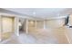 Spacious finished basement with carpet flooring and support beams, offering versatile living space at 15926 Butterwort Cir, Parker, CO 80134
